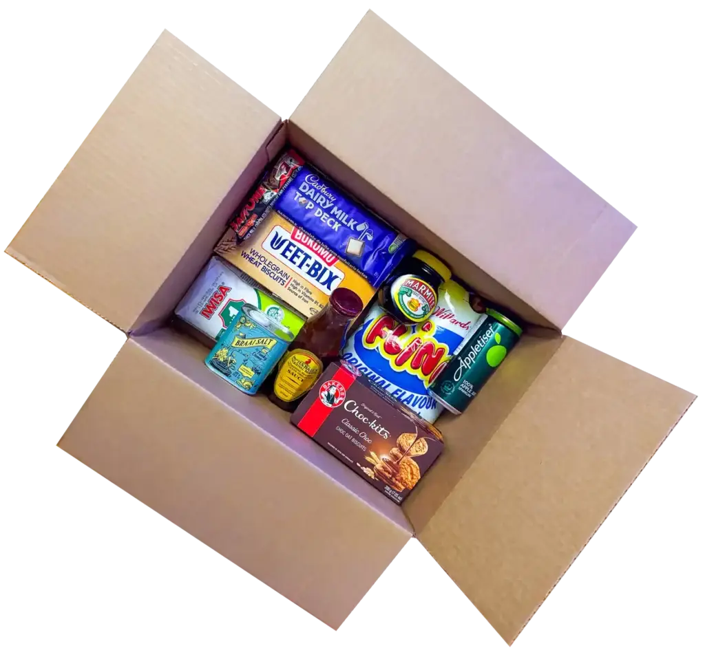 A box of South African snacks and pantry staples, including Cadbury’s Dairy Milk Top Deck, Weet-Bix, Marmite, Appletiser, Flings, and Chutney, ready for shipping anywhere in Canada.
