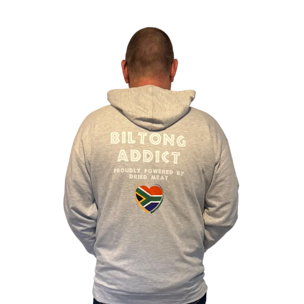 Back view of a gray hoodie featuring the Biltong Addict text, a South African flag heart, and the phrase “Proudly Powered by Dried Meat.”