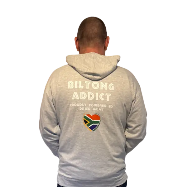 Back view of a gray hoodie featuring the Biltong Addict text, a South African flag heart, and the phrase “Proudly Powered by Dried Meat.”
