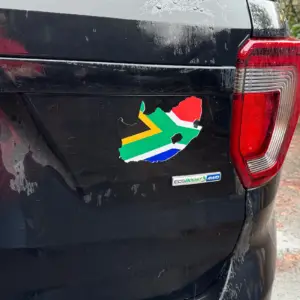 South Africa map sticker with the national flag inside, applied to the back of a black SUV.