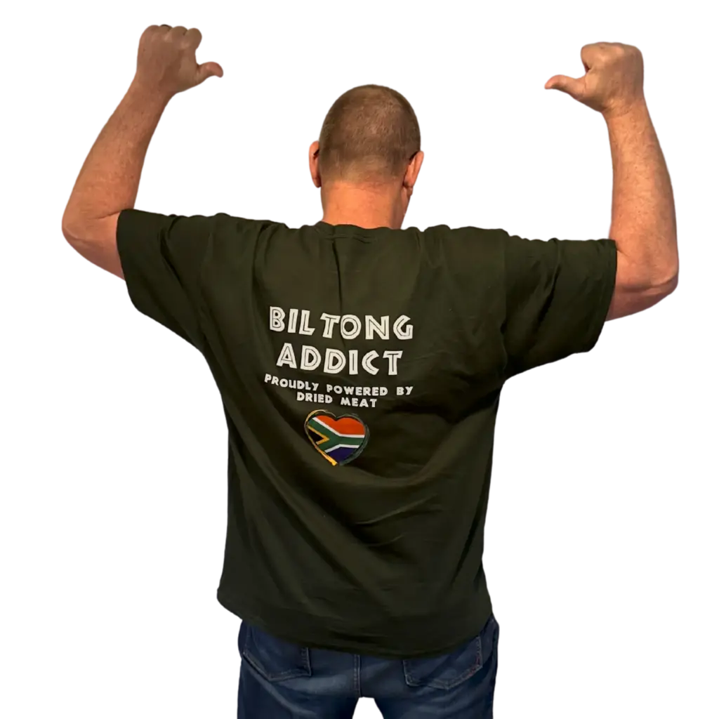 ack view of a man wearing a black Biltong Addict T-shirt featuring bold white text and a South African flag heart design.