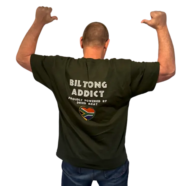 ack view of a man wearing a black Biltong Addict T-shirt featuring bold white text and a South African flag heart design.