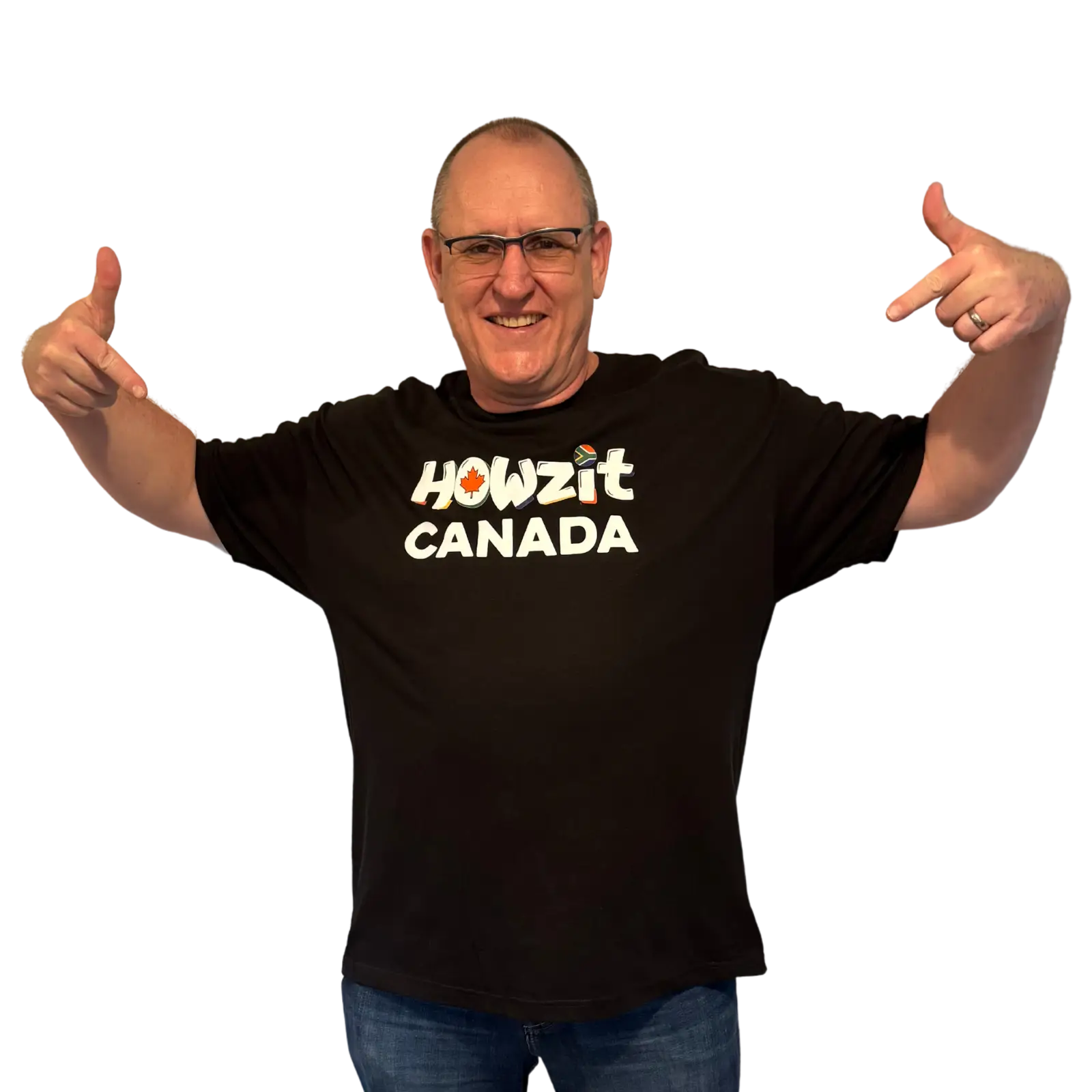 Man wearing a black Howzit Canada T-shirt, pointing to the logo on the front with a big smile.