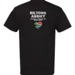 Back view of a black T-shirt with “Biltong Addict” text, “Proudly Powered by Dried Meat” slogan, and a South African flag heart.