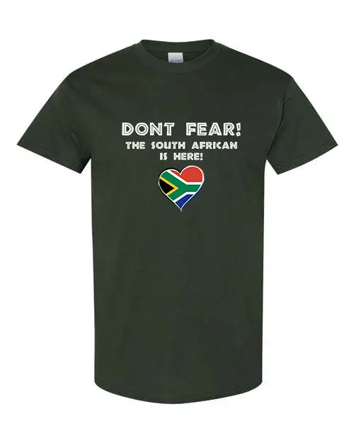 A forest green T-shirt featuring “Don’t Fear! The South African is Here!” text and a heart-shaped South African flag.