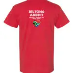 Back view of a red T-shirt with “Biltong Addict” text, “Proudly Powered by Dried Meat” slogan, and a South African flag heart.